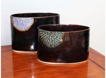 A Pair Of Glazed Ceramic Cache Pots