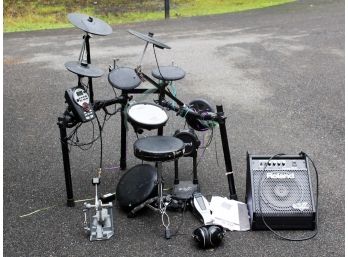 A Roland Drum Pad And Monitor (V-Drums, Drum Sound Module TD-11)