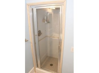A Shower Door And Brushed Nickel Shower Fittings