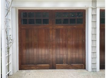 A Solid Wood Paneled Garage Door 1 Of 2
