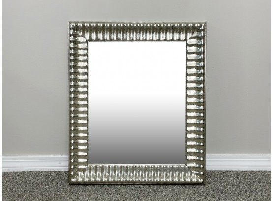 A Mirror In Carved Wood Silver Tone Frame