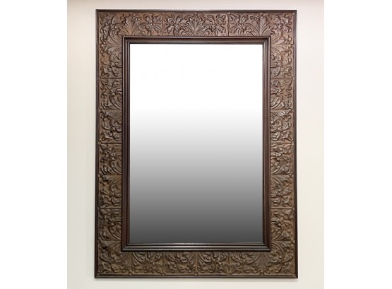 A Large, Embossed Tin Framed Mirror