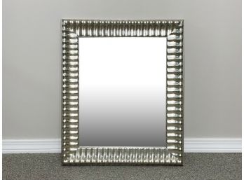 A Mirror In Carved Wood Silver Tone Frame