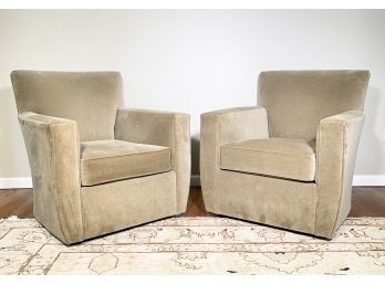 A Pair Of Modern Upholstered Swivel Arm Chairs By Crate And Barrel