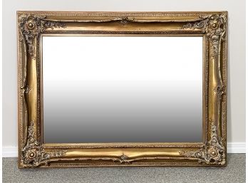 A Large Beveled Mirror In Gilt Wood Frame