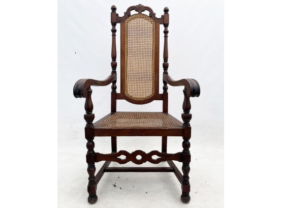 A Vintage Mahogany And Cane Arm Chair.