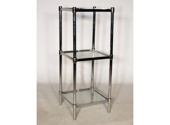 A Chrome And Glass Etagere