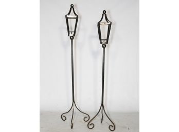 A Pairing Of Tall Decorative Candle Sconces