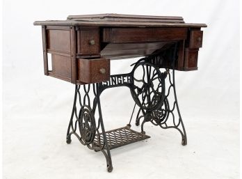 An Antique Singer Sewing Machine Case And Base