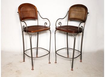 A Pair Of Wrought Iron And Cane Bar Stools From ABC Carpet And Home