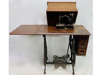 The Wilcox And Gibbs Silent Sewing Machine On Ornamental Iron Stand With Cover Side Leaf And 3 Drawers