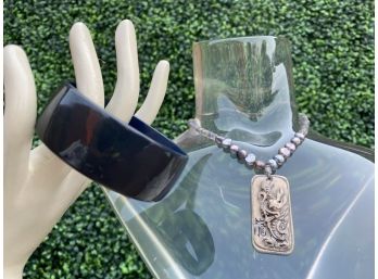 Black Lucite Bracelet And A Carved Pendant Necklace