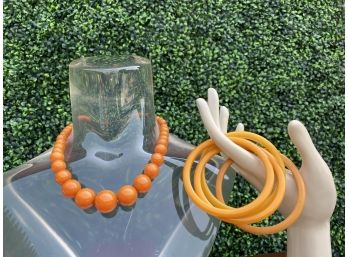 Three Butterscotch Bakelite Bangles And A Gold Graduated Beaded Necklace
