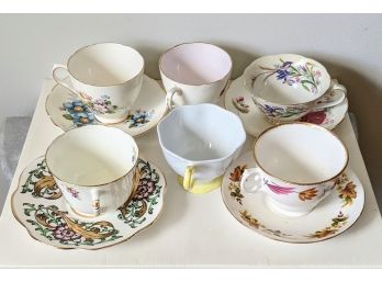 A Group Of 4 Mismatched Porcelain Cups And Saucers .