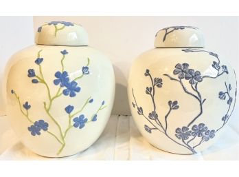 Two Decorative Floral Urns With Blue Floral Embellishments