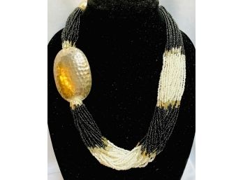 Multi-Tone Multi- Strand Seed Bead Necklace With Hammered Metal Accent