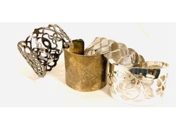 Grouping Of Four Metal Cuff Style Bracelets