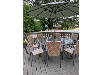 Octagonal, Glass-top Outdoor Table With Grey Base.  8 Wicker-style Vinyl Chairs And Matching Chaise.  Umbr