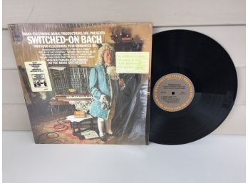 Switched On Bach On 1968 Columbia Records. Vinyl Is Near Mint. Jacket In Partial Shrink Wrap.