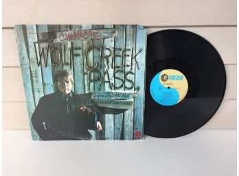 C. W. Mc Call. Wolf Creek Pass On 1975 MGM Records Stereo. Vinyl Is Near Mint. Jacket Is Very Good. Country.