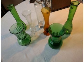 7 Glass Vases & Bottles In Various Styles, Green, Clear, And Brown