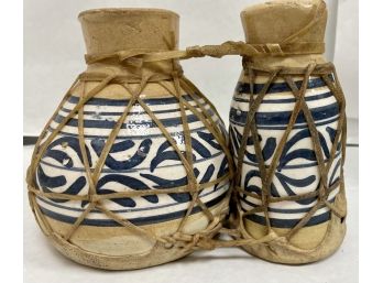 Pair Of Vases Connected With Rawhide With Animal Skin Bottoms