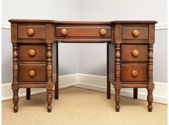 A Solid Hardwood Desk With Turned Legs