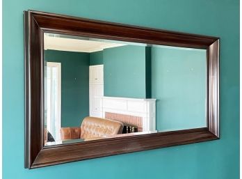 A Very Large Wood Framed Beveled Mirror