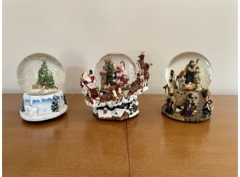 Three Musical Holiday Snow Globes