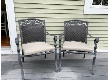 Pair Of Outdoor Chairs With Tan Cushions