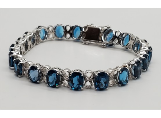 Immaculate Oval London Blue Topaz, Rhodium Over Sterling Bracelet