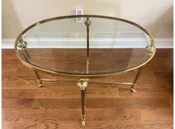 An Elegant Oval Brass And Glass Cocktail Table - 32'w X 26'd X 24'h