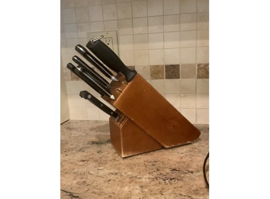 Set Of Knives In A Butcher Block