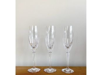 A Trio Of Lenox Crystal Champagne Glasses