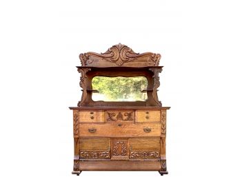 Remarkable Antique Quarter Sewn Tiger Oak Side Board With Finely Detailed Carved Scrollwork And Finial Mirror