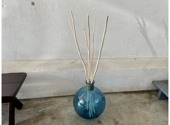 Blue Glass Globe Vase With Decorative Drift Wood Rods