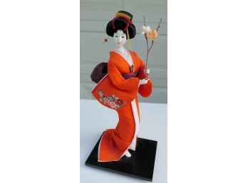 Vintage Geisha Girl Doll In Kimono With A Stem Of Flowers
