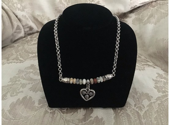 Silvered And Polished Stone Necklace Centered With A Heart Pendant