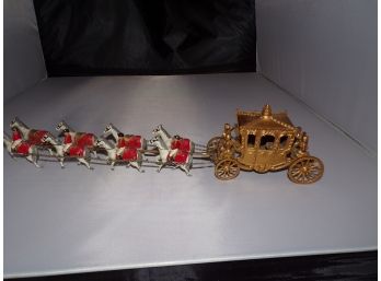 Old Brass Carriage With Horses And Riders