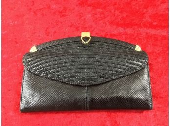 Black Clutch With Gold Colored Clasps
