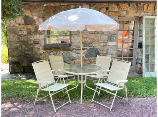 A Vintage Tubular Metal And Glass Outdoor Dining Set