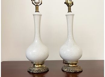 A Pair Of Painted Glass Lamps On Brass Bases