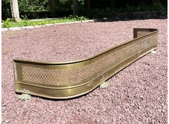 A Large Antique Footed Brass Fireplace Fender