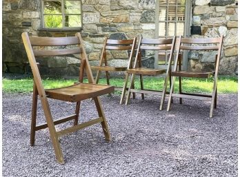 A Set Of 4 Vintage Wood Folding Chairs