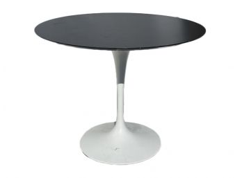 A Vintage Modern Dining Table (Possibly Eero Saarinen For Knoll) - Cast Iron Base, Lacquered Wood Top