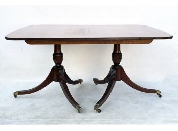 An Antique Mahogany Extendable Dining Table
