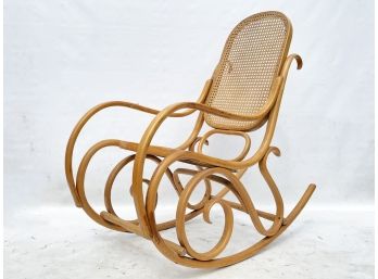 A Vintage Mid Century Bentwood And Cane Rocker By Thonet