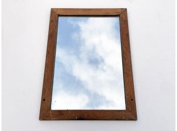 A Vintage Mirror In Simple Pine Wood Frame
