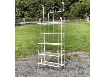 A Vintage Wrought Iron Bakers Rack With Plexi Shelves