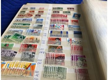Hundreds Of Foreign Stamps In A Book